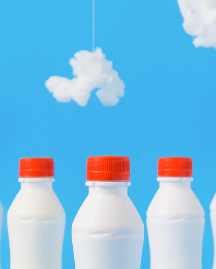 milk bottles with a blue sky background